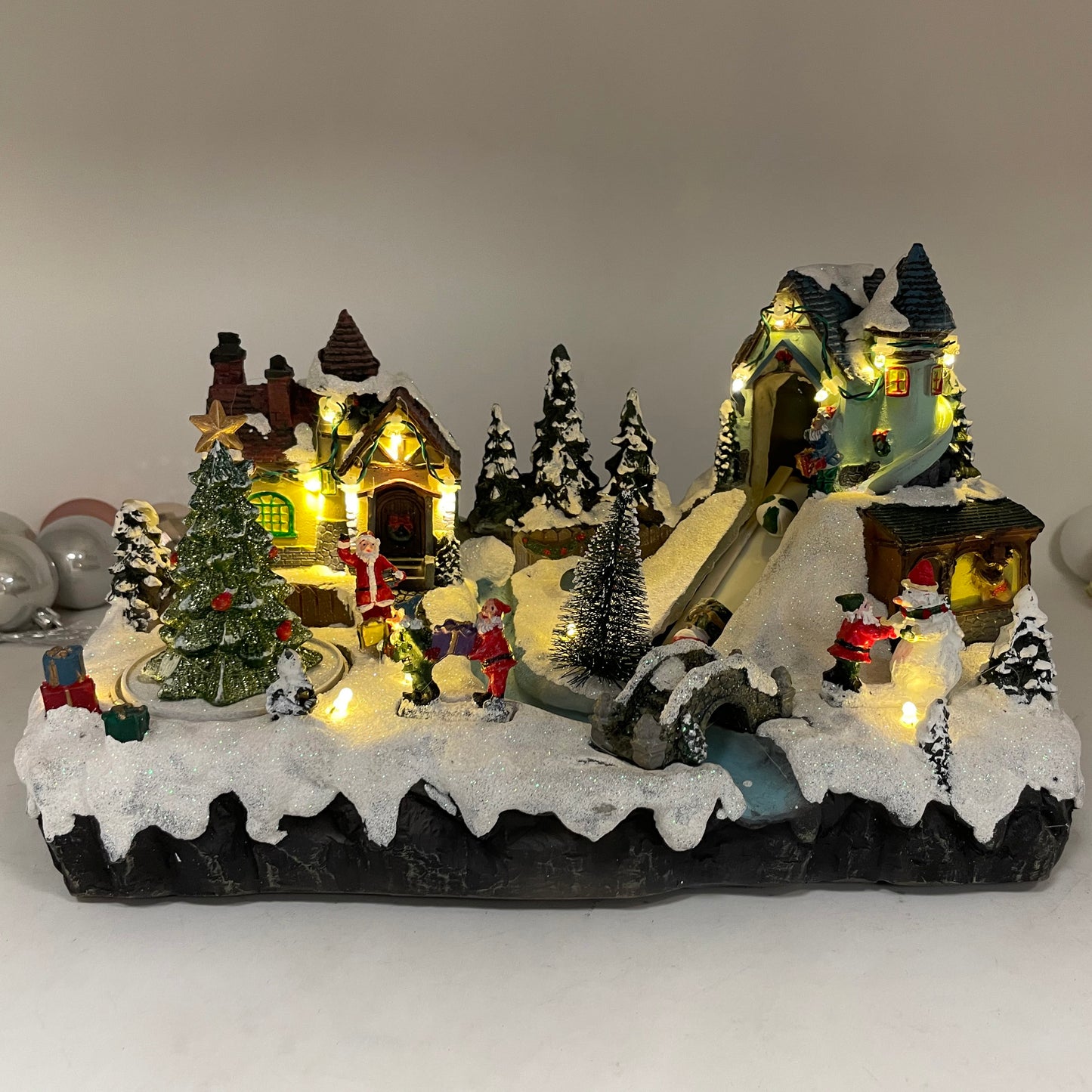 Crafted Polyresin Christmas House Collectable Figurine with USB and Battery Dual Power Source-Santa Village with Moving Toy Belt-XH93417