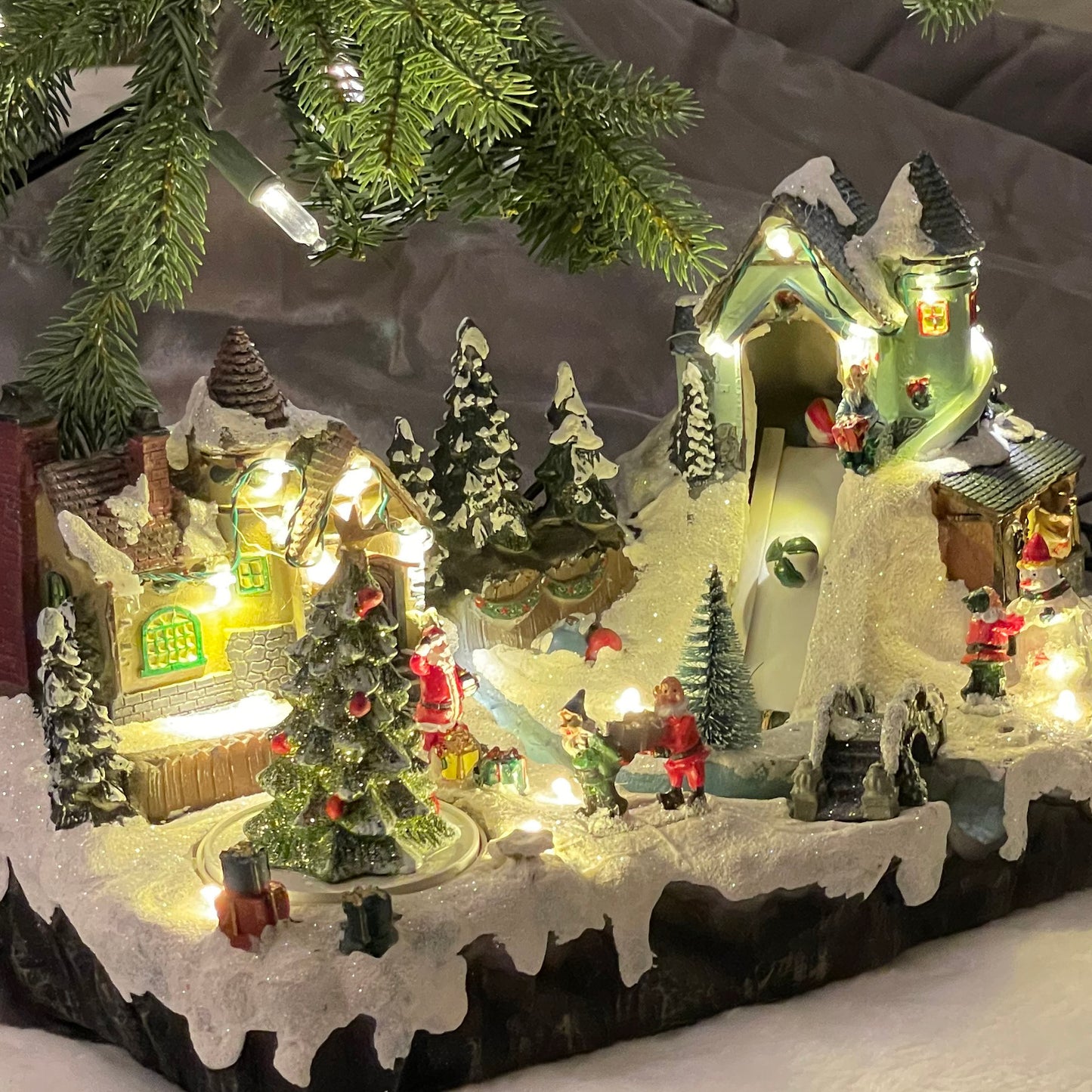 Crafted Polyresin Christmas House Collectable Figurine with USB and Battery Dual Power Source-Santa Village with Moving Toy Belt-XH93417